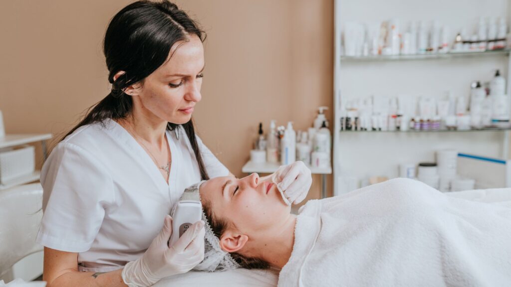 image showing a beauty therapist doing a facial to a woman in a spa