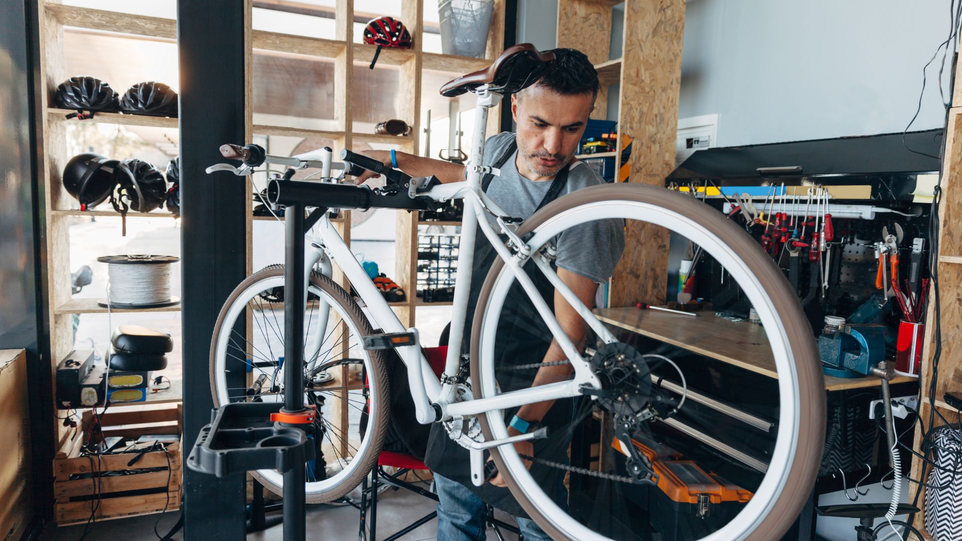 image showing a bicycle mechanic working on a bike