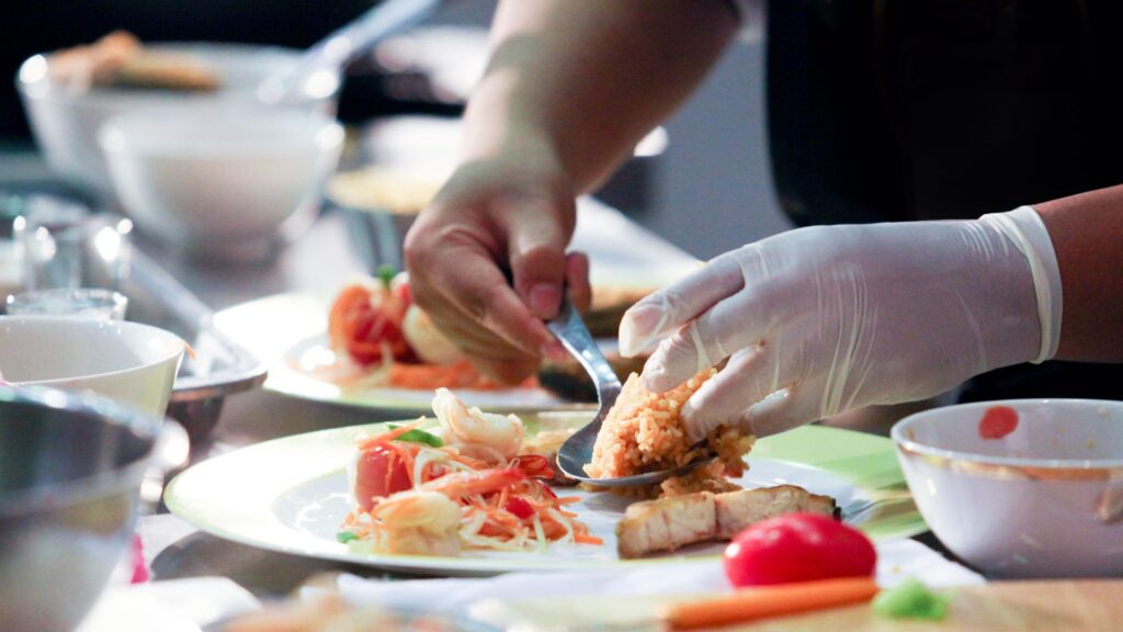 image showing a chef de partie assembling food