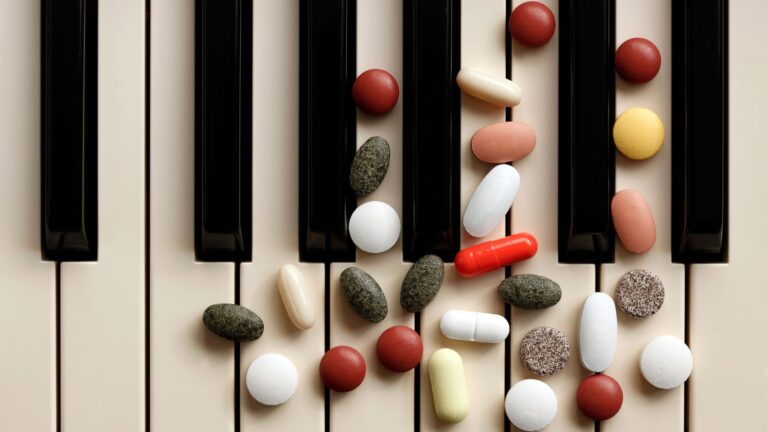 image showing a piano with pills on the keys