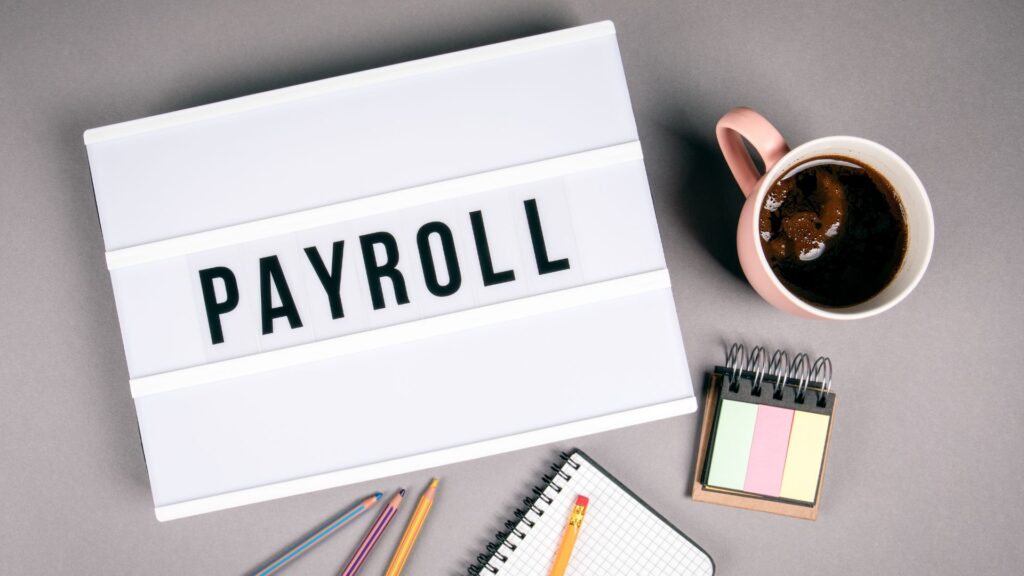image showing elements of payroll on a desk