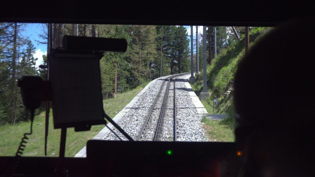 image showing a train driver navigating down train tracks
