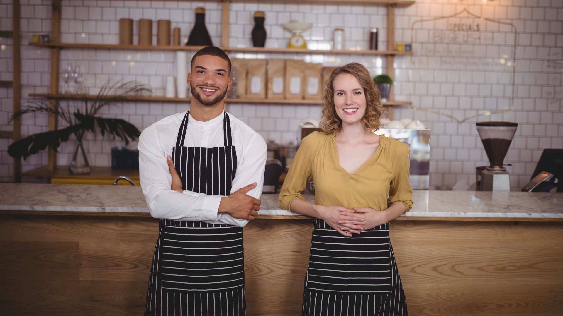 image showing two waiting staff members about to help customers before their shift